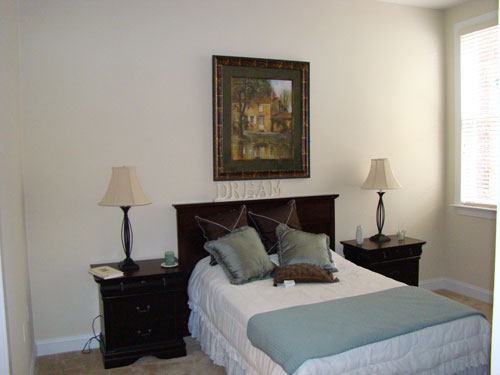 an elegant apartment bedroom at Eagle Mill Towers